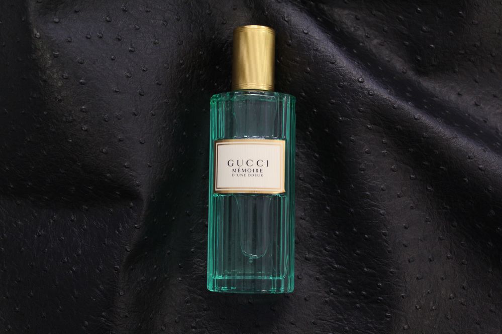 Image of Gucci Memoire d'une Odeur Eau de Parfum bottle against a black background.JPG